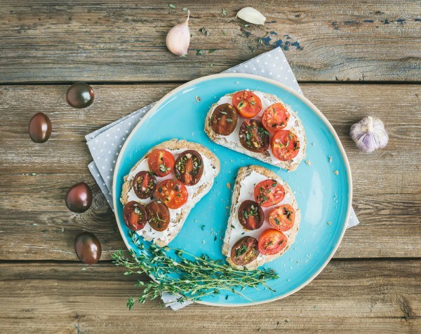Vegetarian sandwich brusketta cherry tomato garlic food table