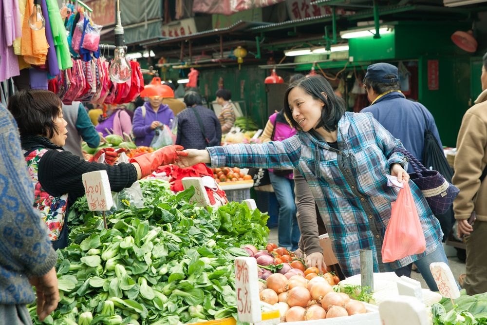 Woman buying vegetables
