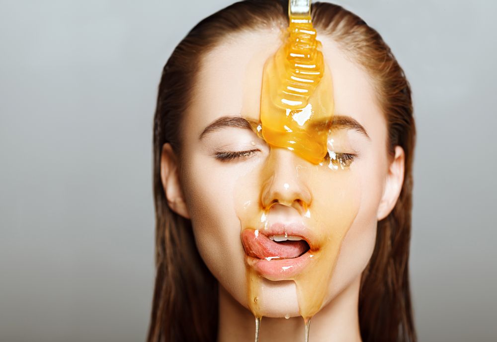 woman with honey on her face