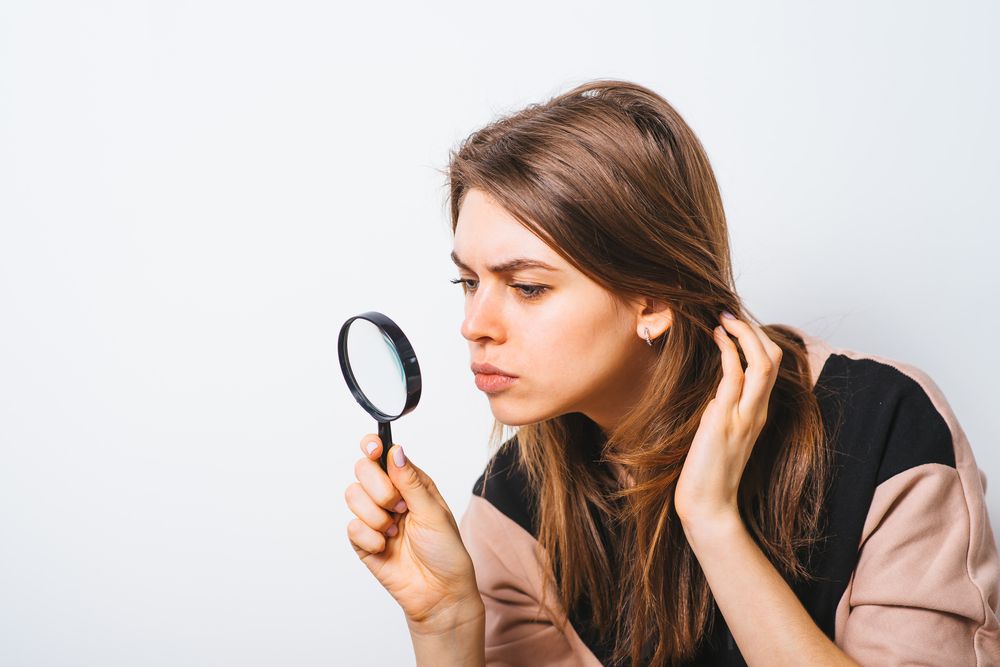Woman magnifying glass search