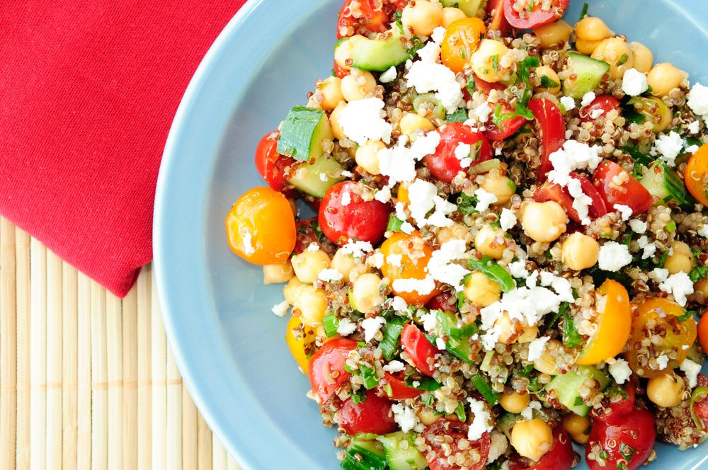 vegetarian salad made with quinoa, chickpeas, feta and fresh heirloom tomatoes