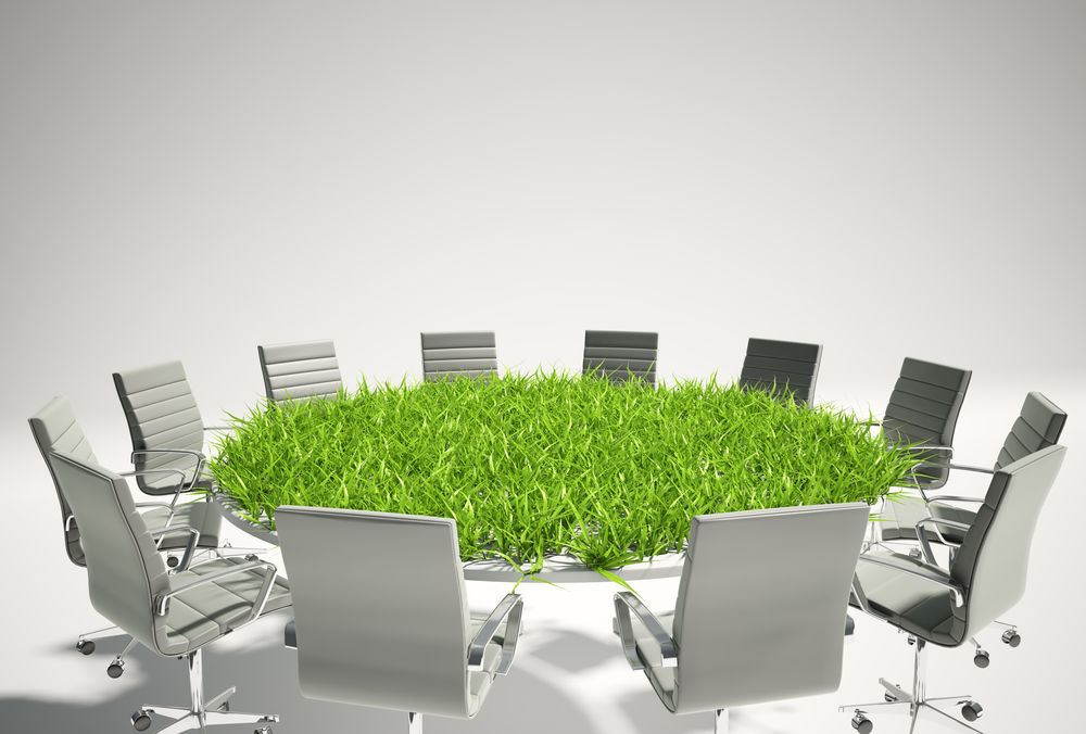 conference-table-covered-with-grass-business-outlook-concept