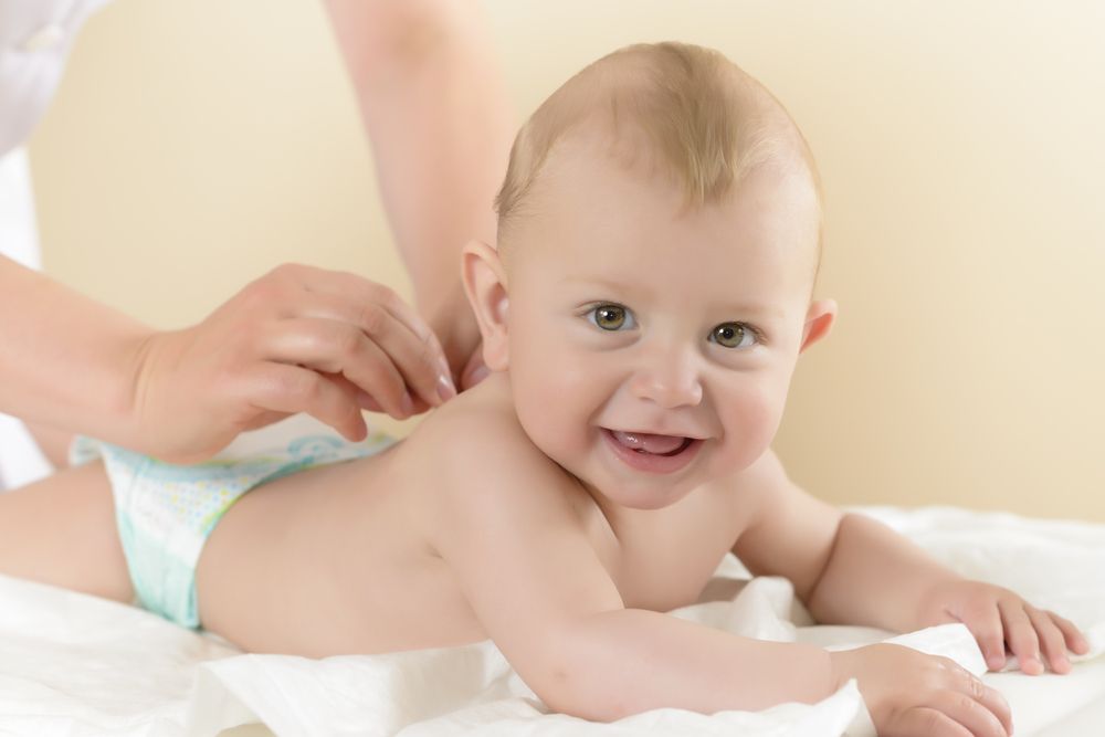 newborn-baby-getting-oil-massage