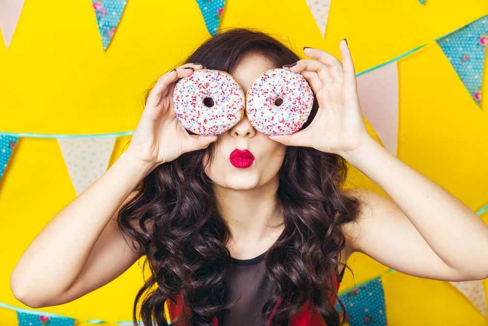 beauty-girl-taking-colorful-donuts-funny-joyful-woman-with-sweets-dessert